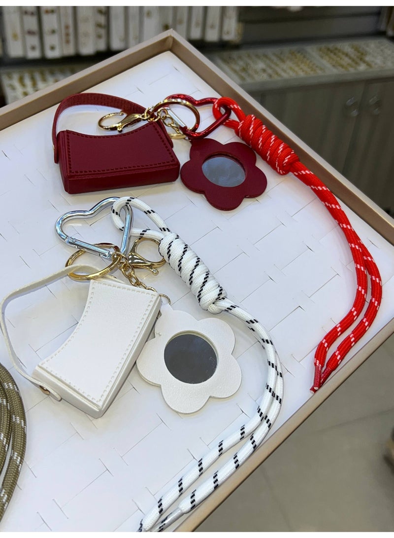 A stylish heart-shaped bag and keychains in assorted colors - Image 1